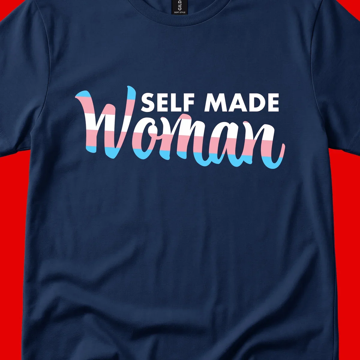Self Made Woman design featuring bold wavy striped lettering in pink, white, and blue trans flag colors