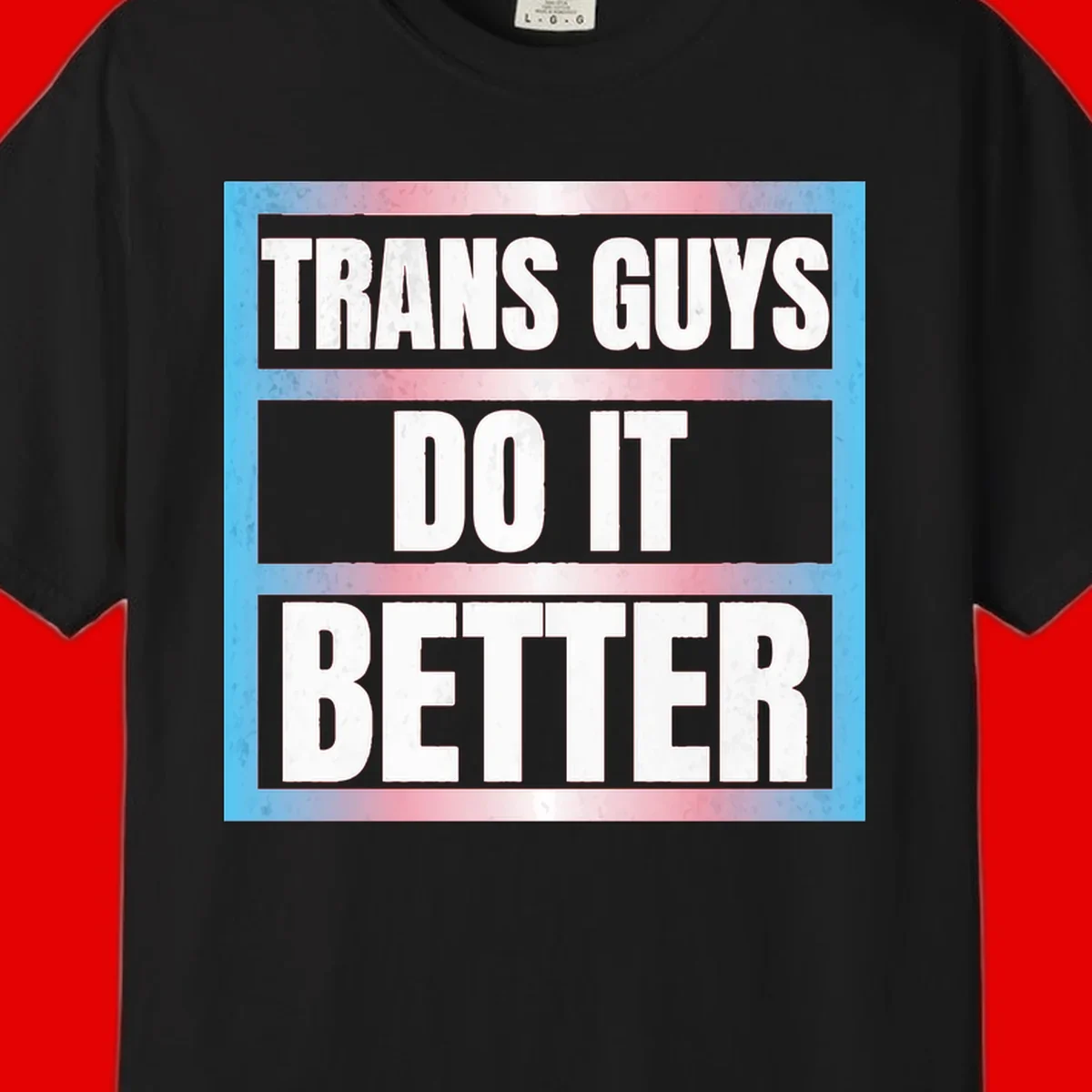 Bold white text reading 'TRANS GUYS DO IT BETTER' on gray bands with transgender flag watercolor background in blue, pink, and white.