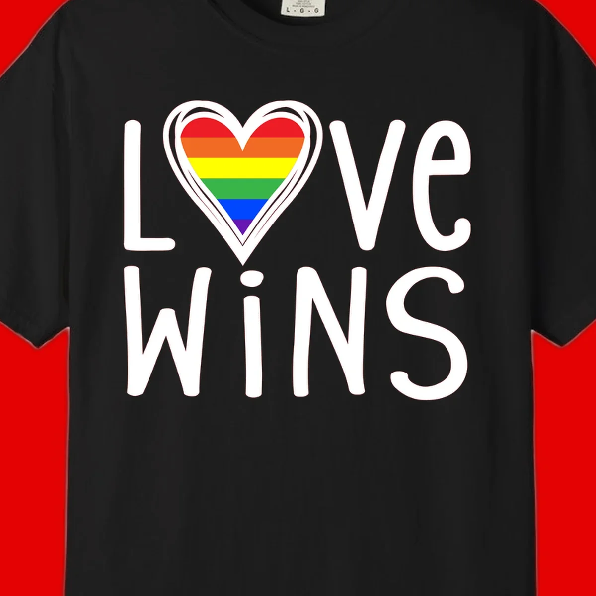 Love wins rainbow heart design with pride flag colors in white outlined heart shape and text