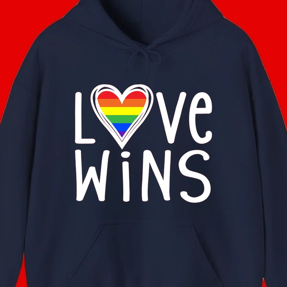 Love wins rainbow heart design with pride flag colors in white outlined heart shape and text