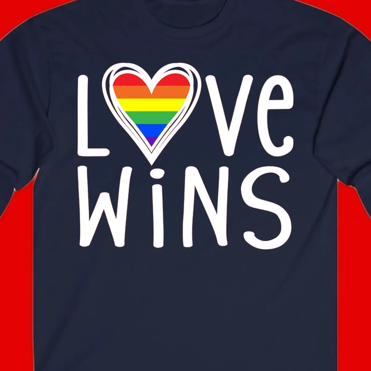 Love wins rainbow heart design with pride flag colors in white outlined heart shape and text