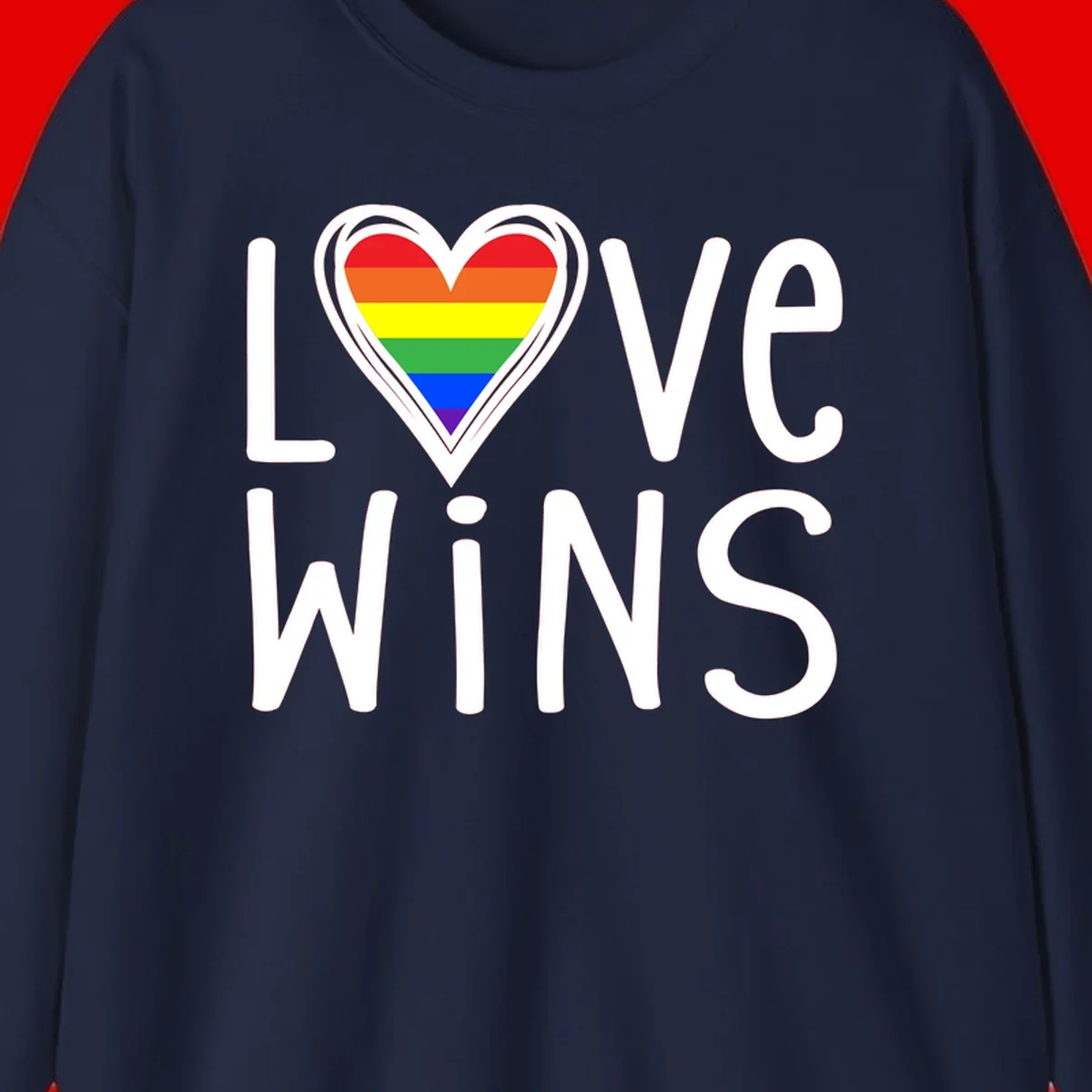 Love wins rainbow heart design with pride flag colors in white outlined heart shape and text