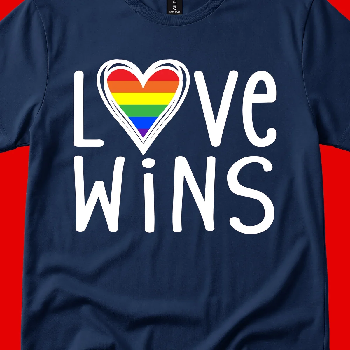 Love wins rainbow heart design with pride flag colors in white outlined heart shape and text