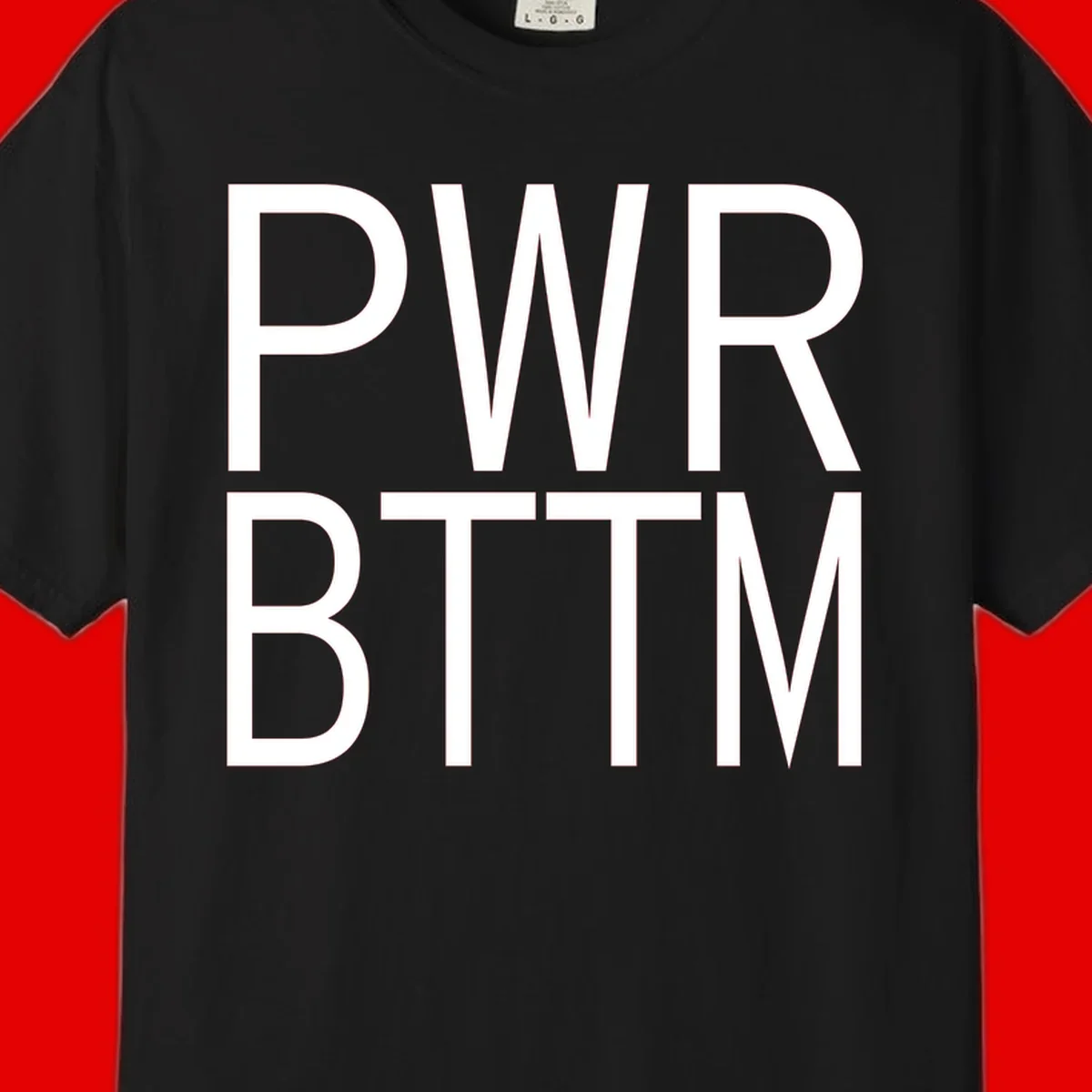 PWR BTTM pride shirt design with bold white sans-serif lettering stacked vertically on gray background