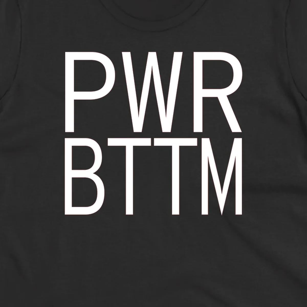 PWR BTTM pride shirt design with bold white sans-serif lettering stacked vertically on gray background