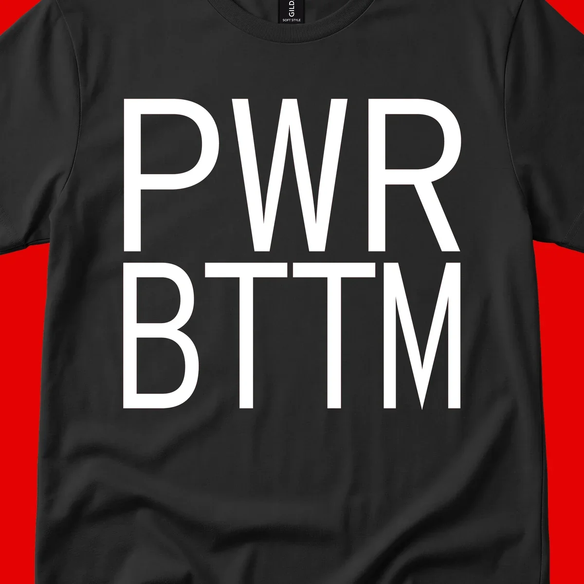 PWR BTTM pride shirt design with bold white sans-serif lettering stacked vertically on gray background