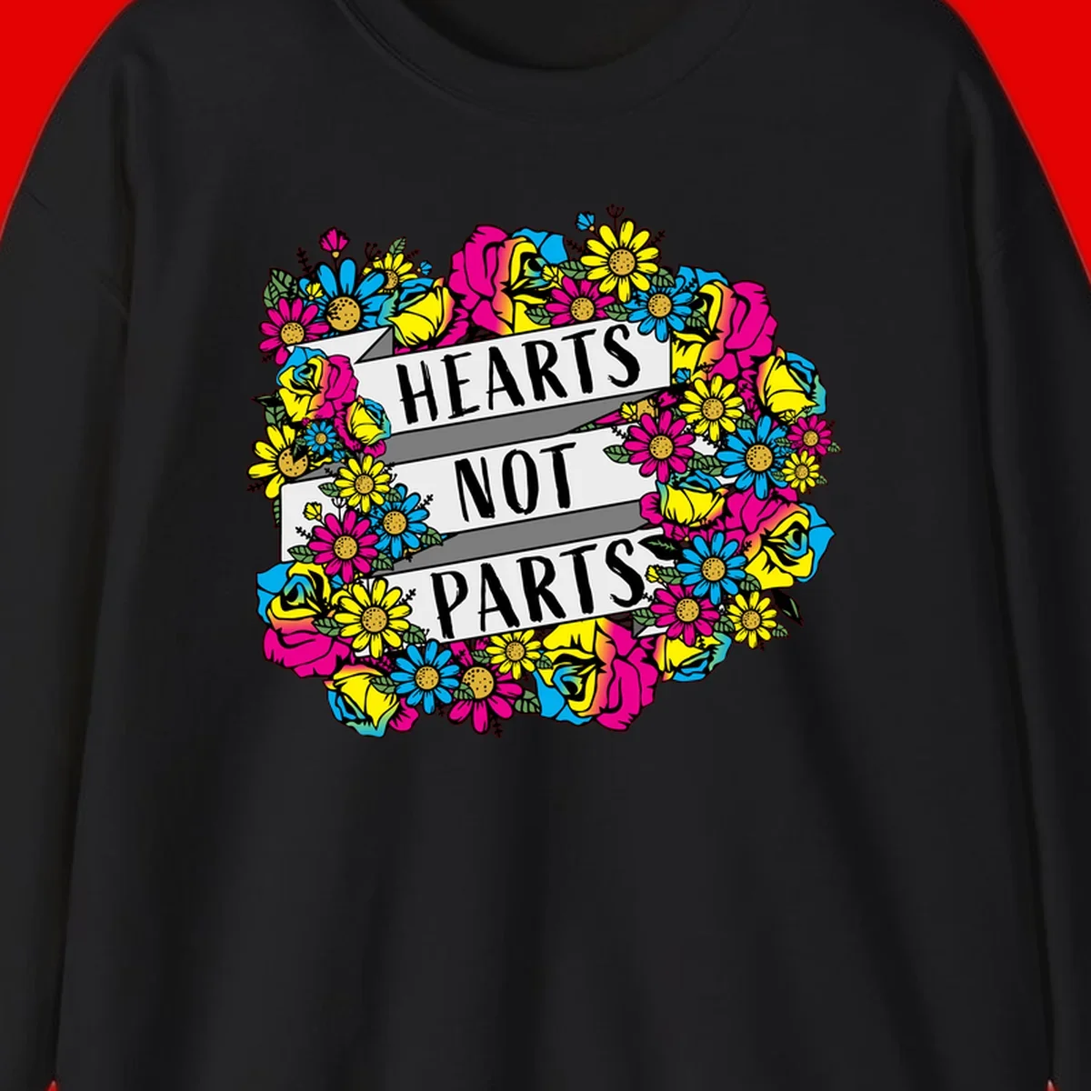 Hearts Not Parts pride design with colorful floral wreath featuring yellow daisies, magenta roses, and blue flowers surrounding bold statement text