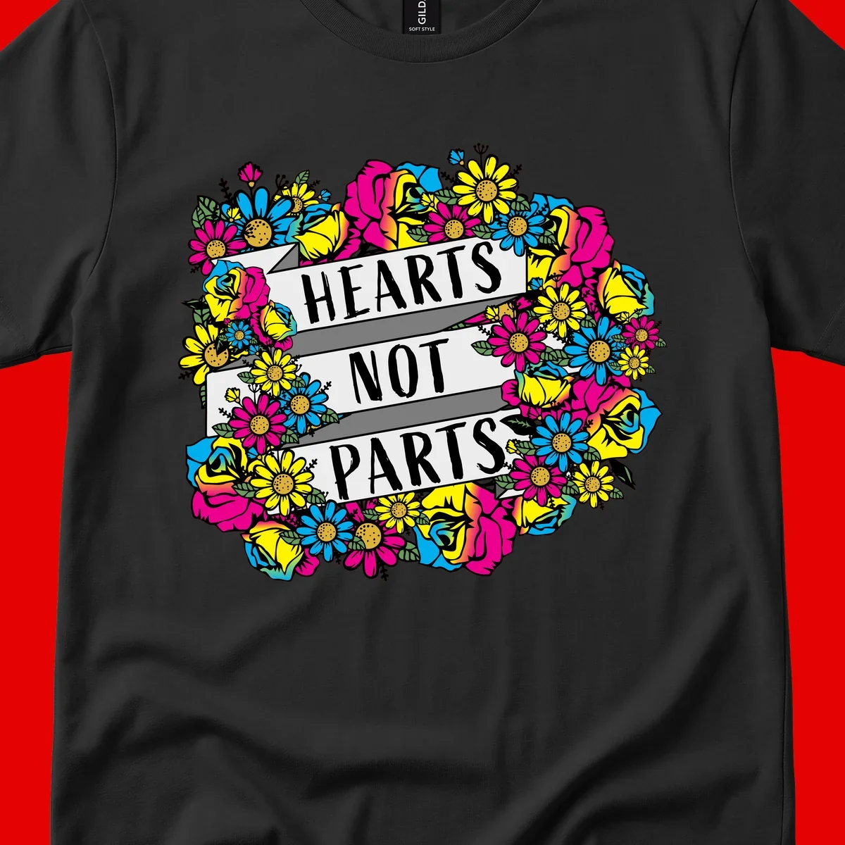 Hearts Not Parts pride design with colorful floral wreath featuring yellow daisies, magenta roses, and blue flowers surrounding bold statement text