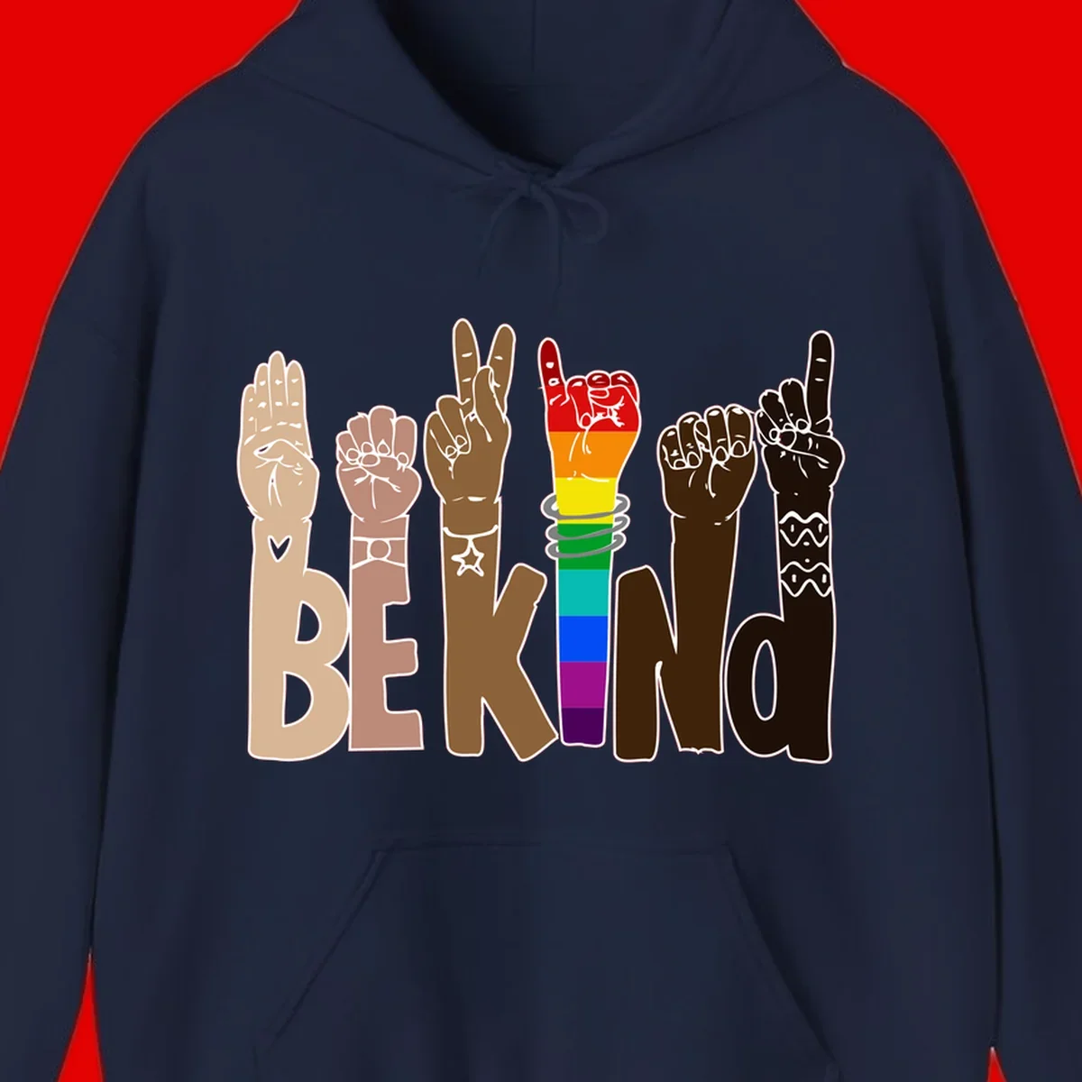 Six illustrated hands in diverse skin tones displaying peace signs and fists, with center fist in rainbow pride colors and 'BE KIND' text below