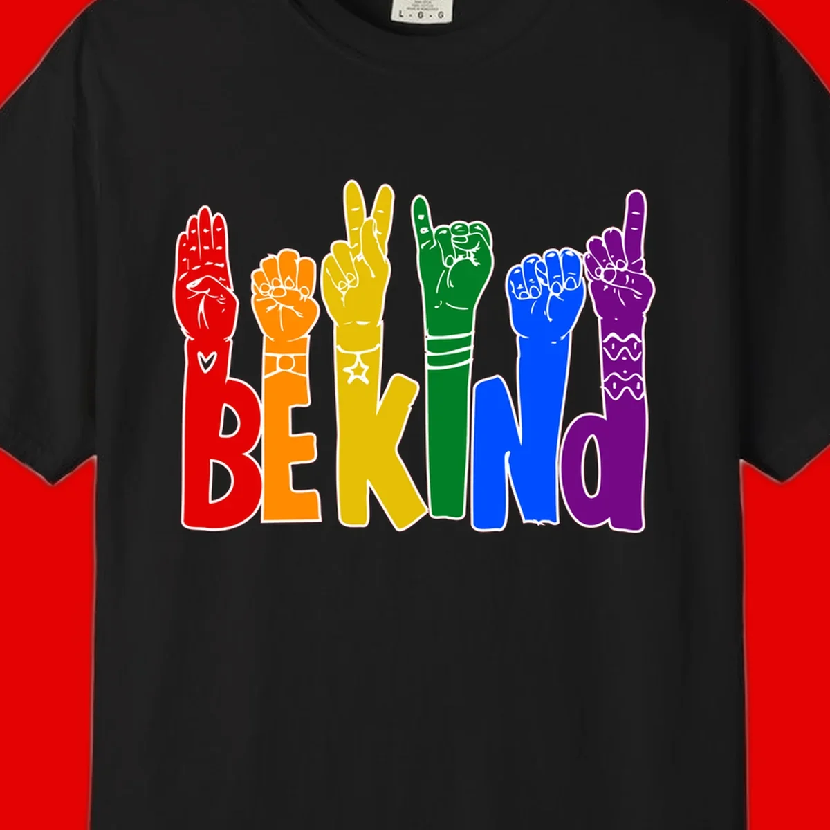 Six colorful raised fists in rainbow colors with 'BE KIND' text, promoting pride, equality, and inclusive messaging