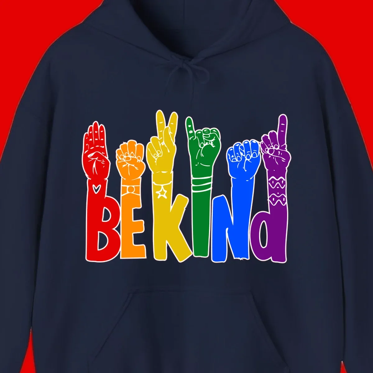 Six colorful raised fists in rainbow colors with 'BE KIND' text, promoting pride, equality, and inclusive messaging