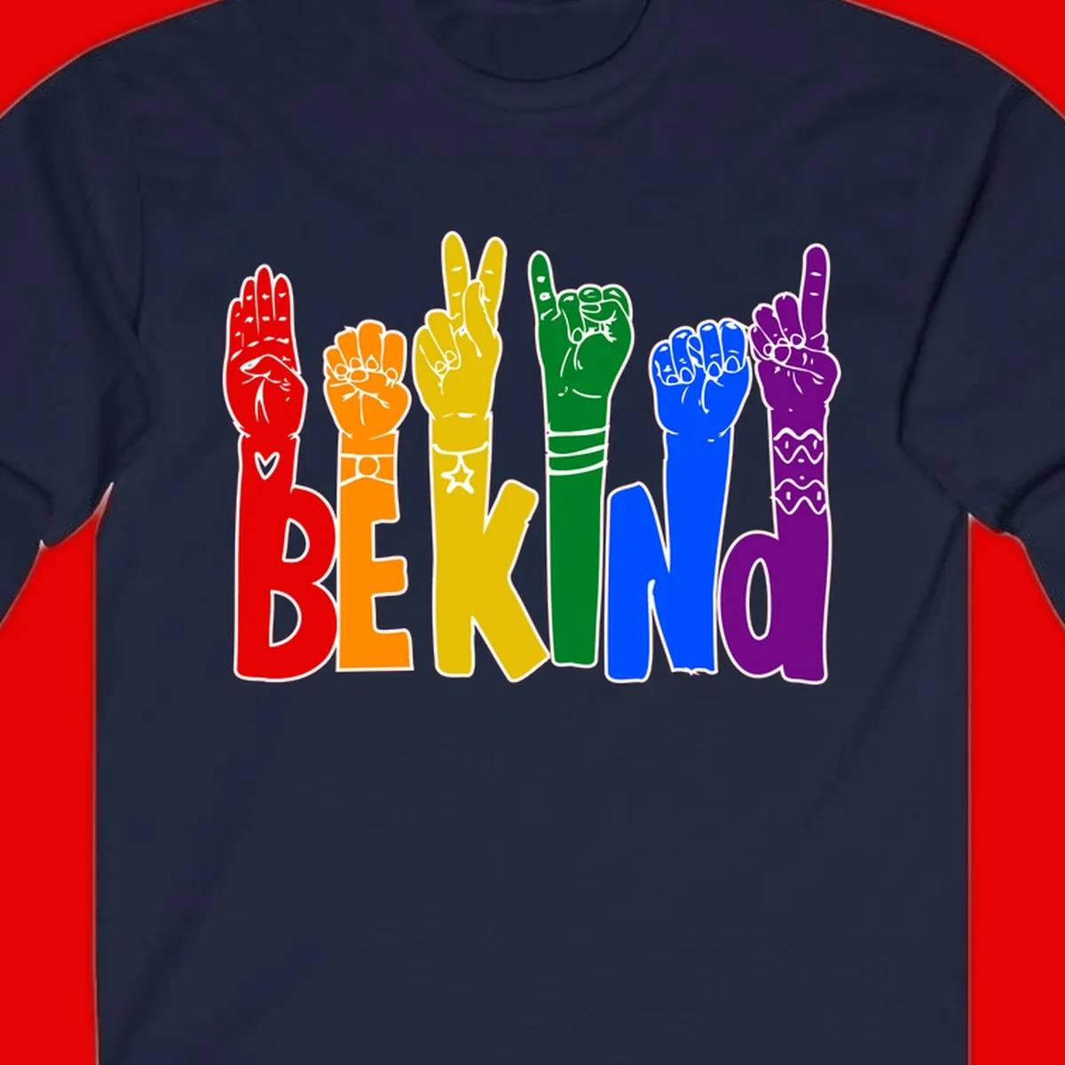 Six colorful raised fists in rainbow colors with 'BE KIND' text, promoting pride, equality, and inclusive messaging