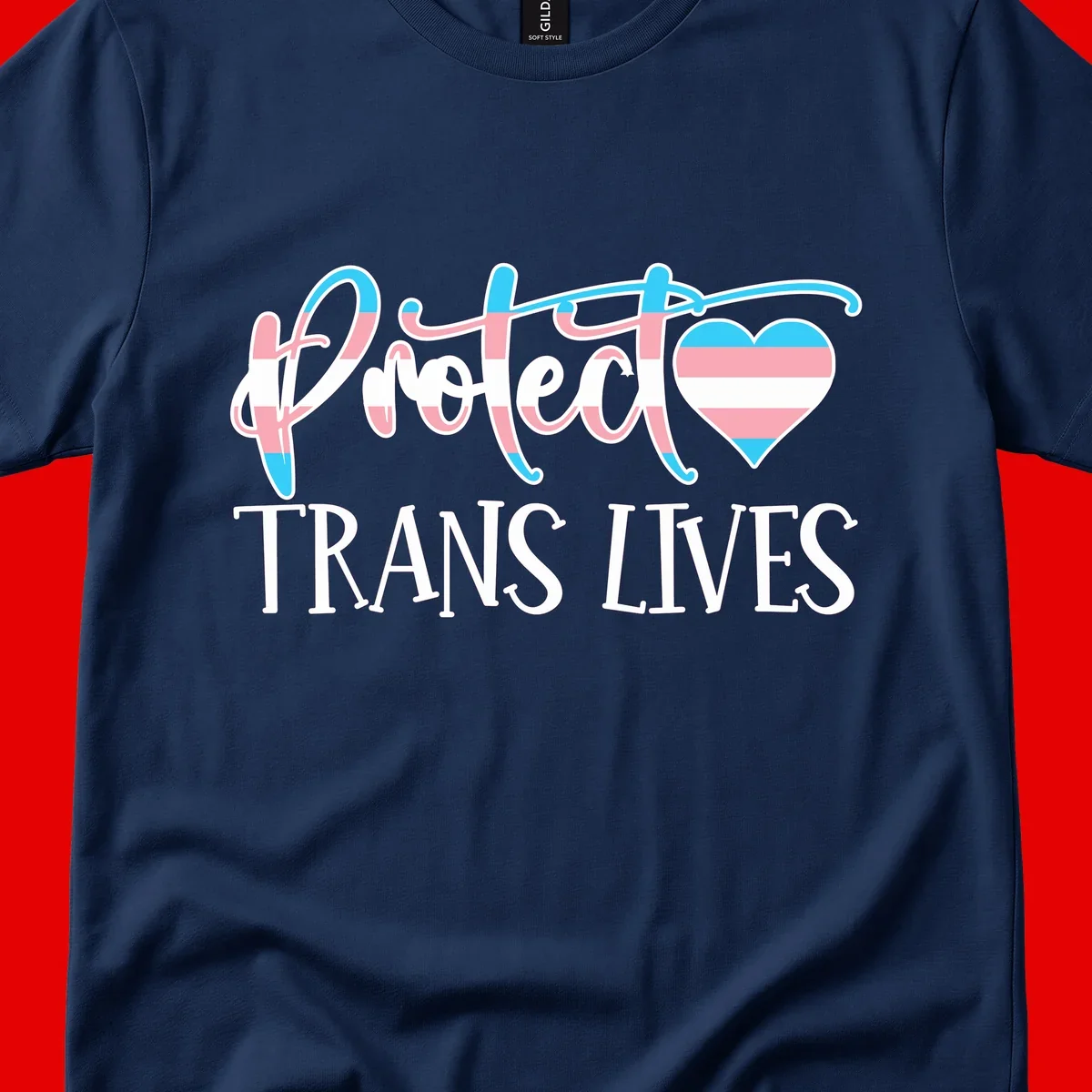 Stylized text 'I heart TRANS LIVES' with decorative letters and a trans flag-striped heart symbol in pink, white, and blue colors