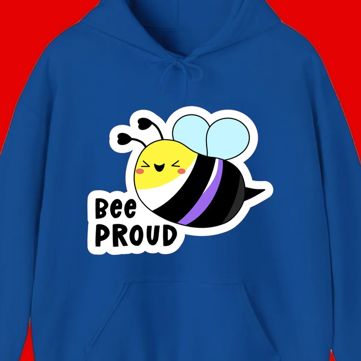 Cartoon bee with yellow head, purple-striped black body, and blue wings smiling happily with text 'BEE PROUD' below