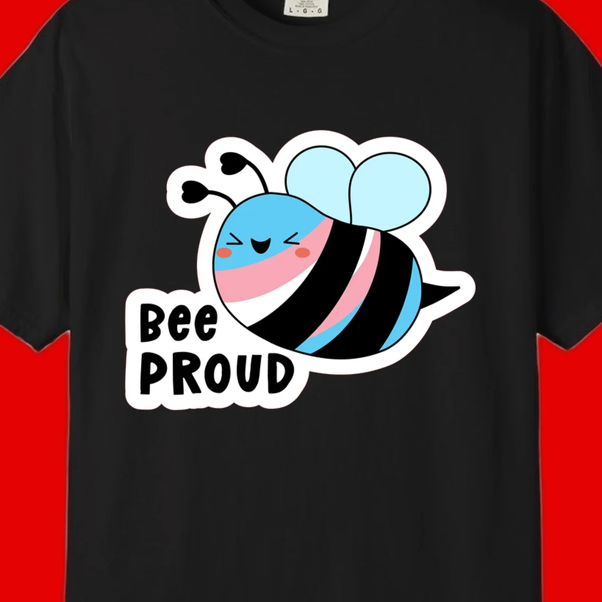 Smiling cartoon bee with blue head, pink mouth, striped body, and light blue wings next to 'Bee Proud' text