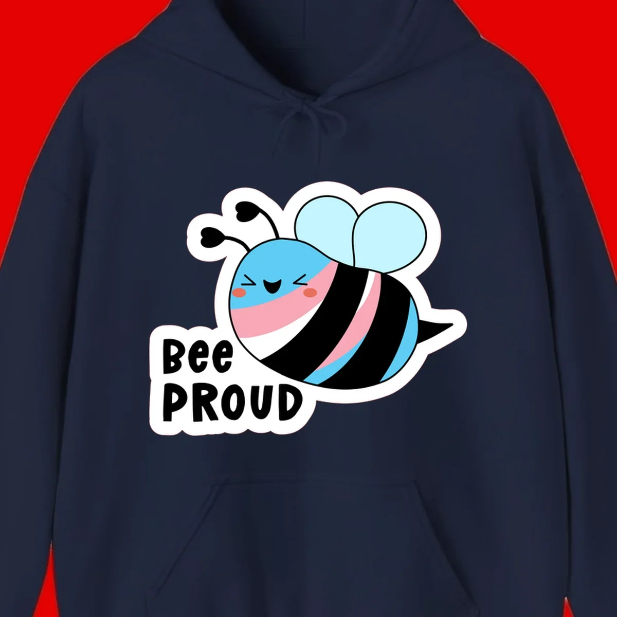 Smiling cartoon bee with blue head, pink mouth, striped body, and light blue wings next to 'Bee Proud' text