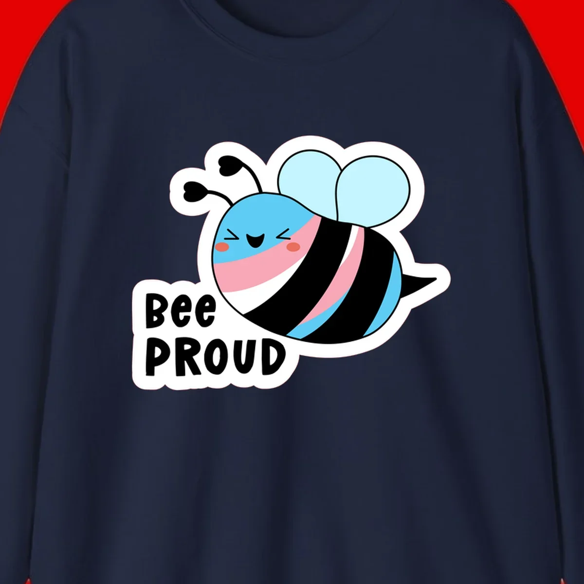 Smiling cartoon bee with blue head, pink mouth, striped body, and light blue wings next to 'Bee Proud' text