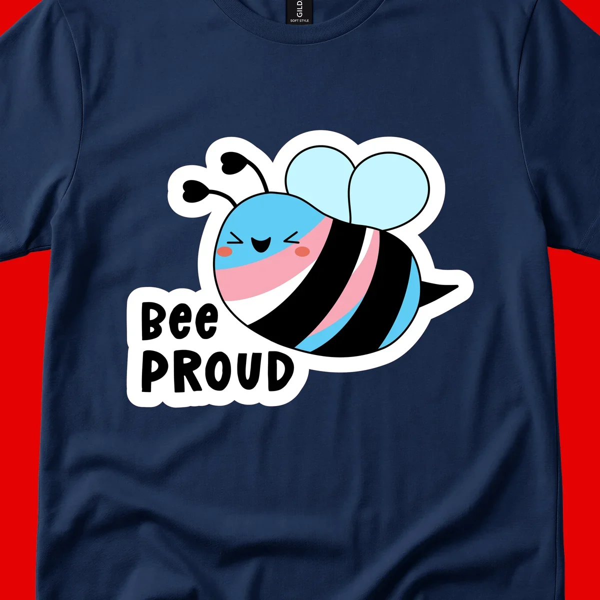 Smiling cartoon bee with blue head, pink mouth, striped body, and light blue wings next to 'Bee Proud' text