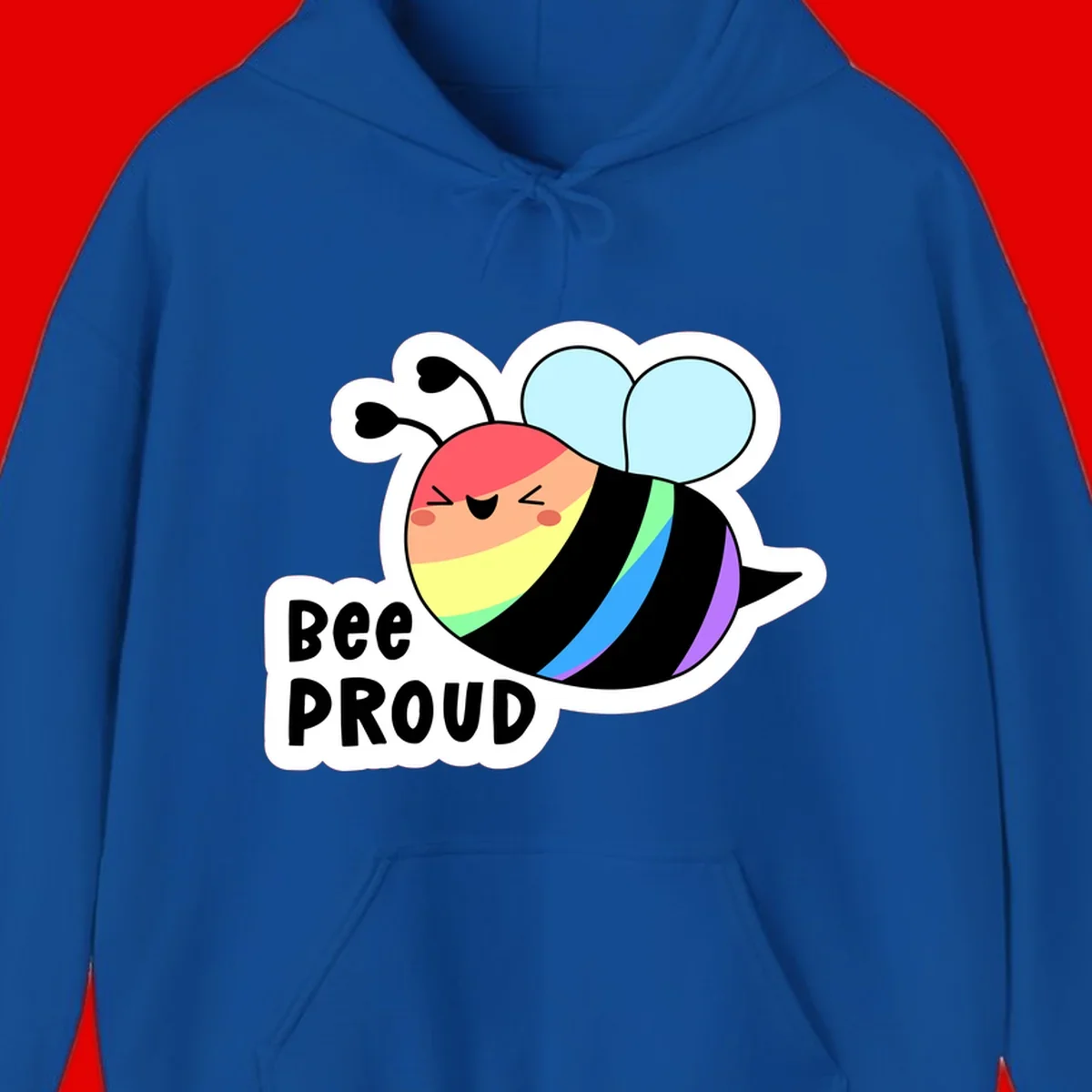 Cartoon bee with rainbow stripes and 'Bee PROUD' text celebrating LGBTQ+ pride