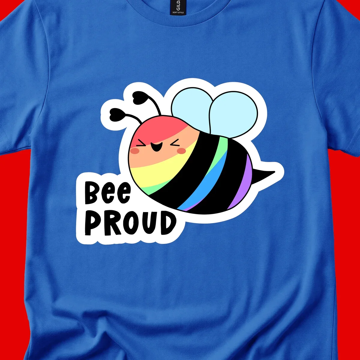 Cartoon bee with rainbow stripes and 'Bee PROUD' text celebrating LGBTQ+ pride