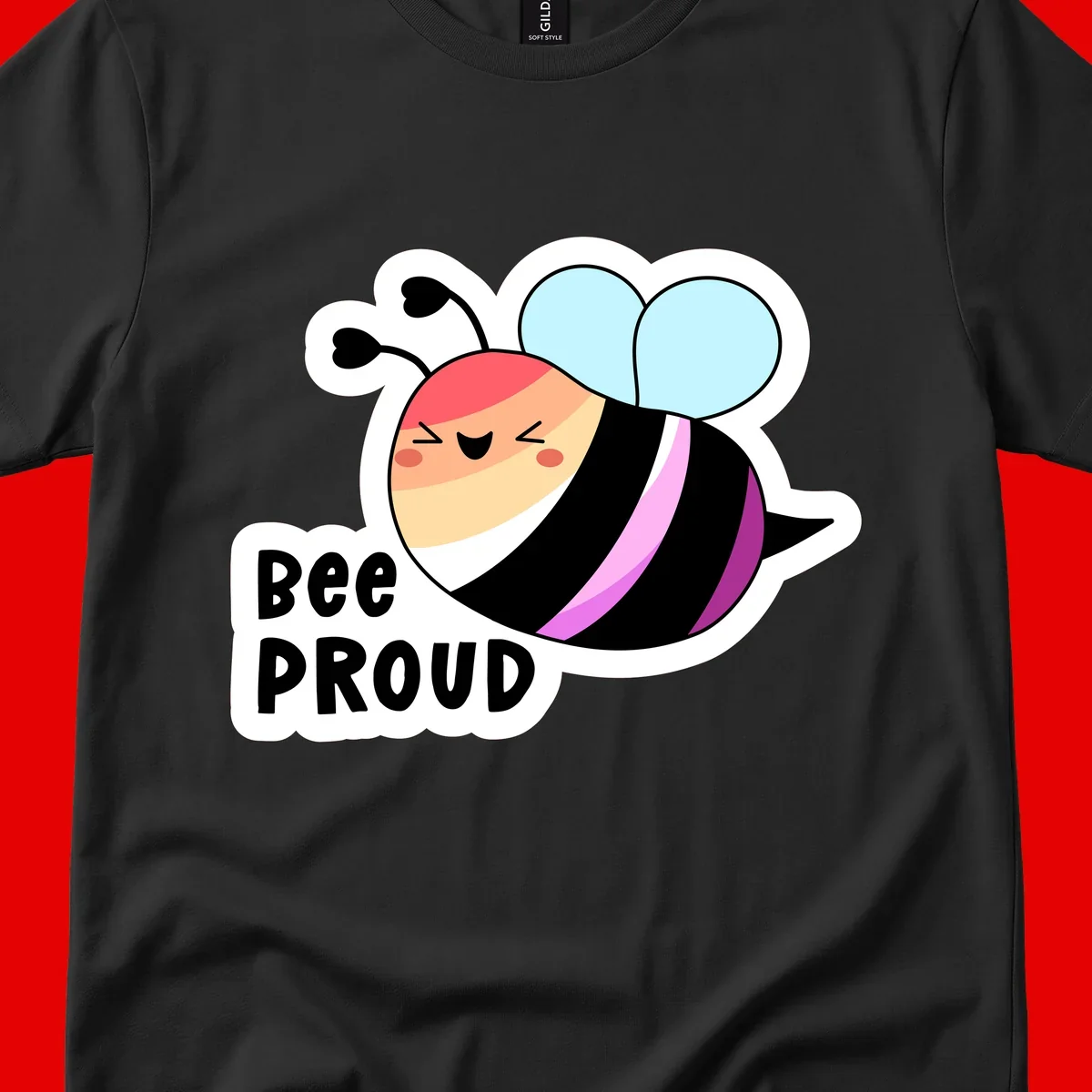 Cheerful cartoon bee with peach face and pink-striped body next to 'Bee Proud' text celebrating pride and individuality