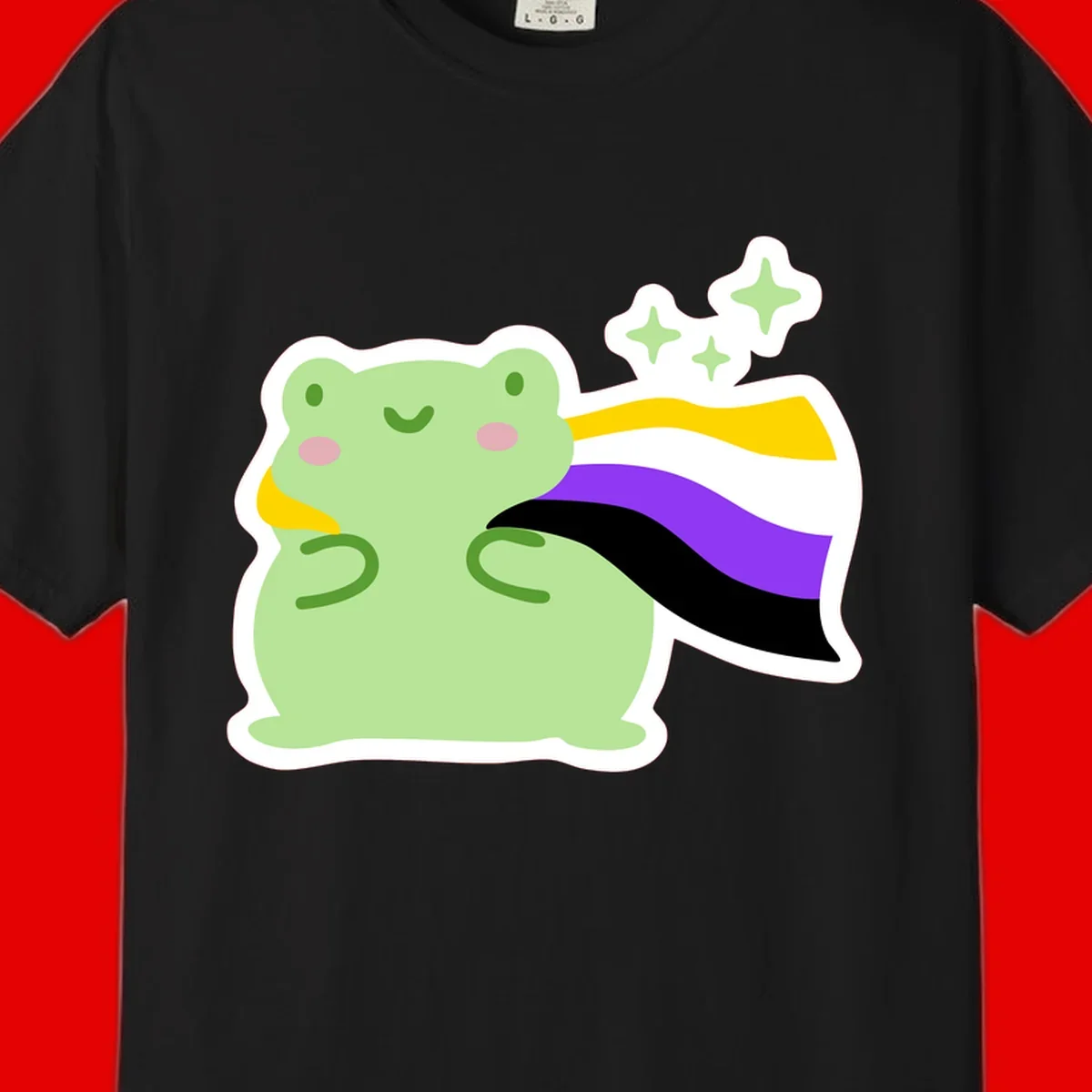 Cute green frog with pink cheeks wearing a yellow, purple, and black rainbow cape with floating sparkle stars