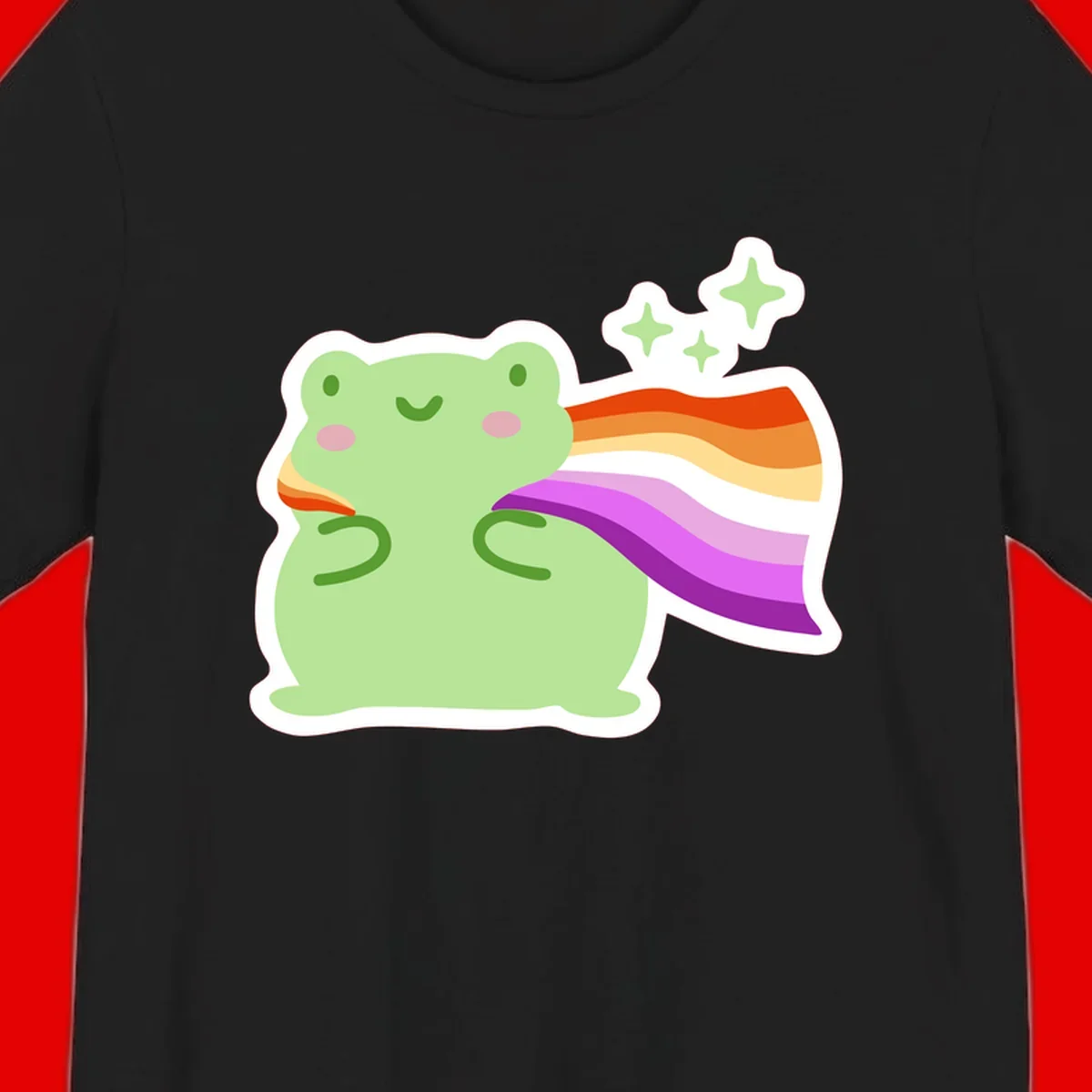Cute green frog with pink cheeks wearing a rainbow pride cape, surrounded by sparkle stars