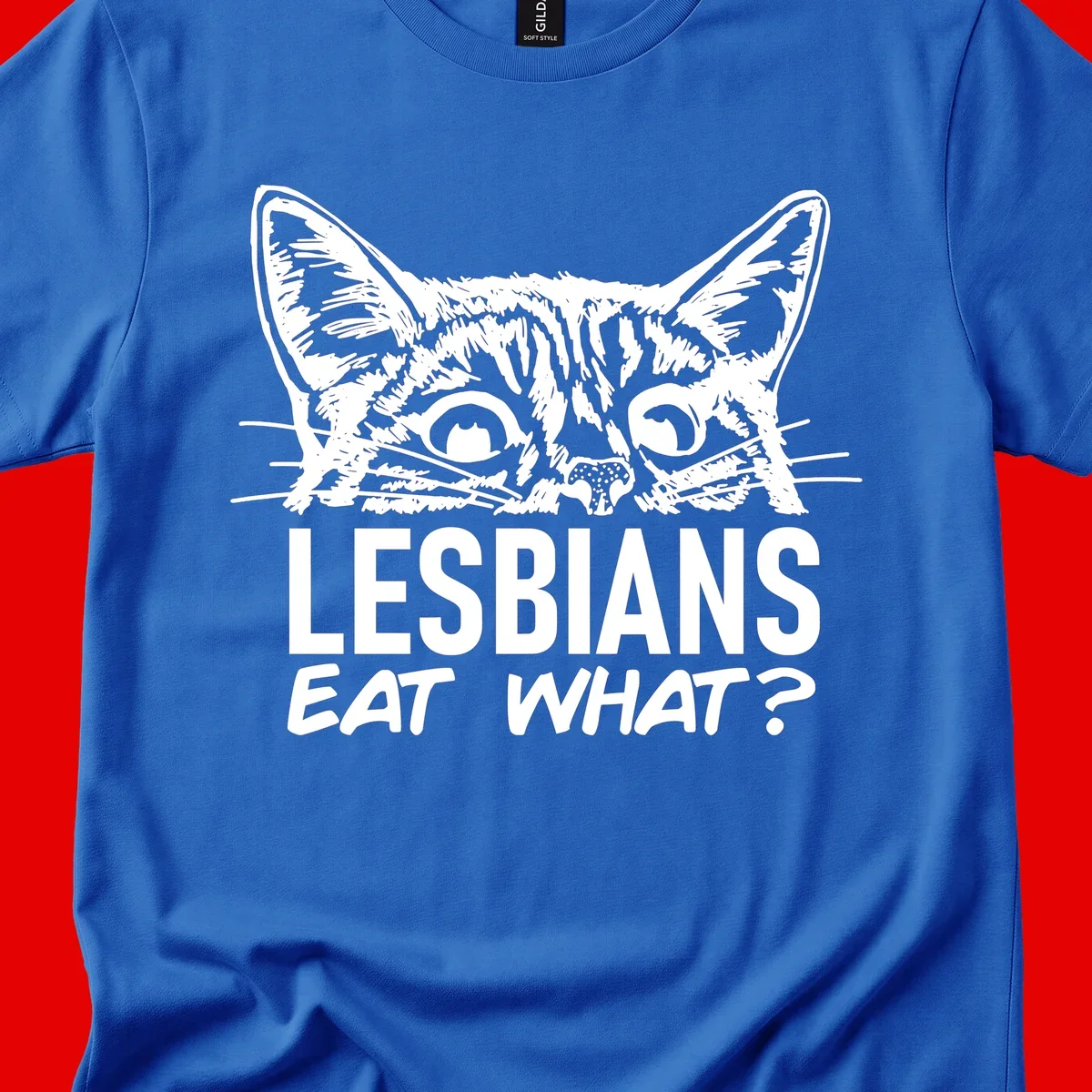 Lesbians eat what cat design: Detailed line-art cat face with expressive eyes and whiskers above bold text reading 'LESBIANS EAT WHAT?'