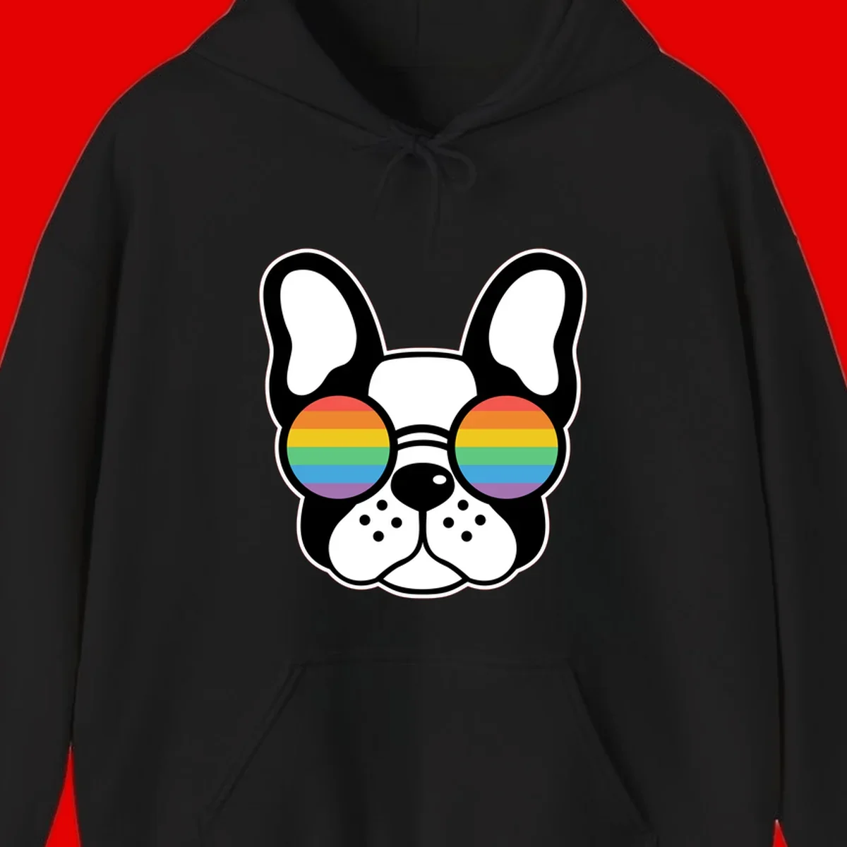 Black and white French Bulldog wearing round sunglasses with rainbow pride flag stripes in red, orange, yellow, green, blue, and purple.