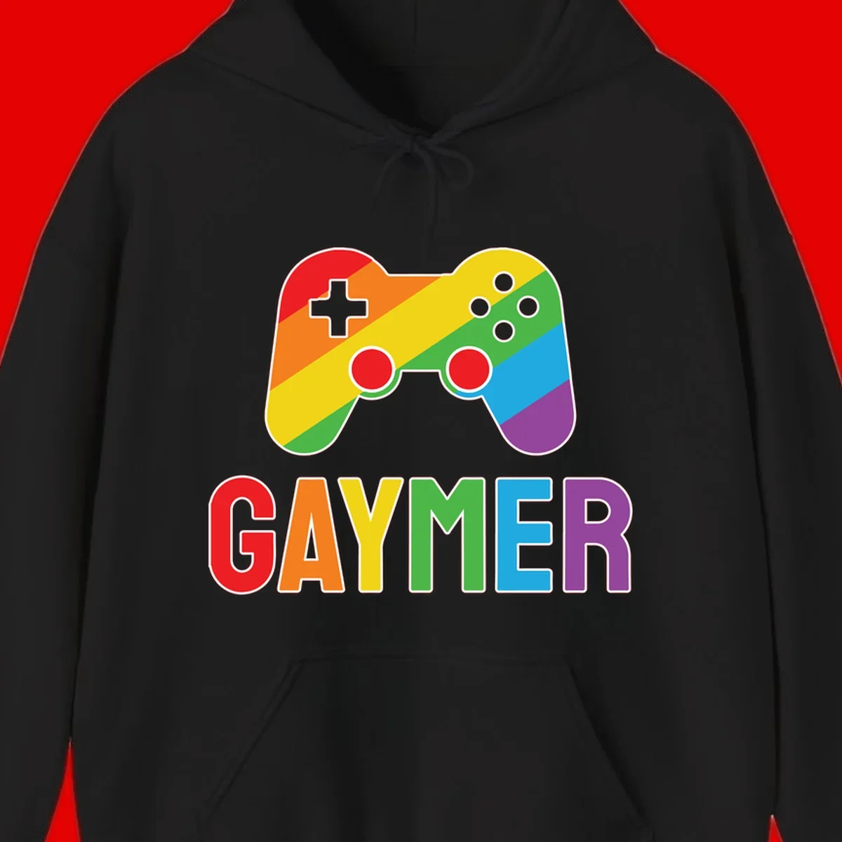 Rainbow gradient game controller with multicolored GAMER text below, featuring pride colors in diagonal stripes
