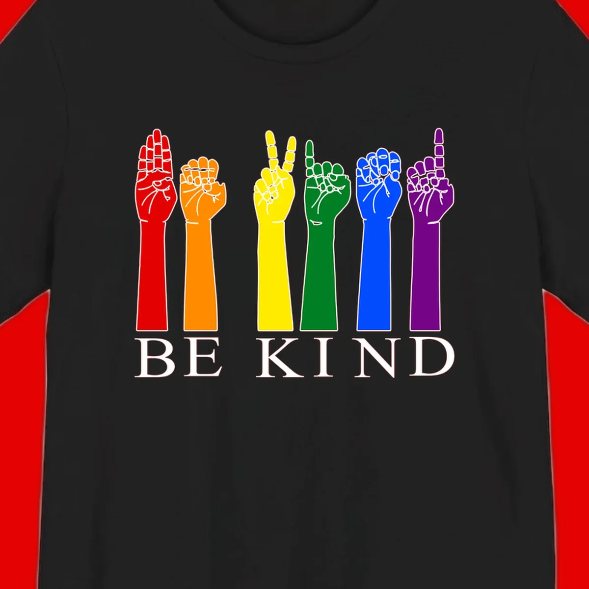 Six rainbow-colored raised hands in red, orange, yellow, green, blue, and purple with white line details and 'BE KIND' text below