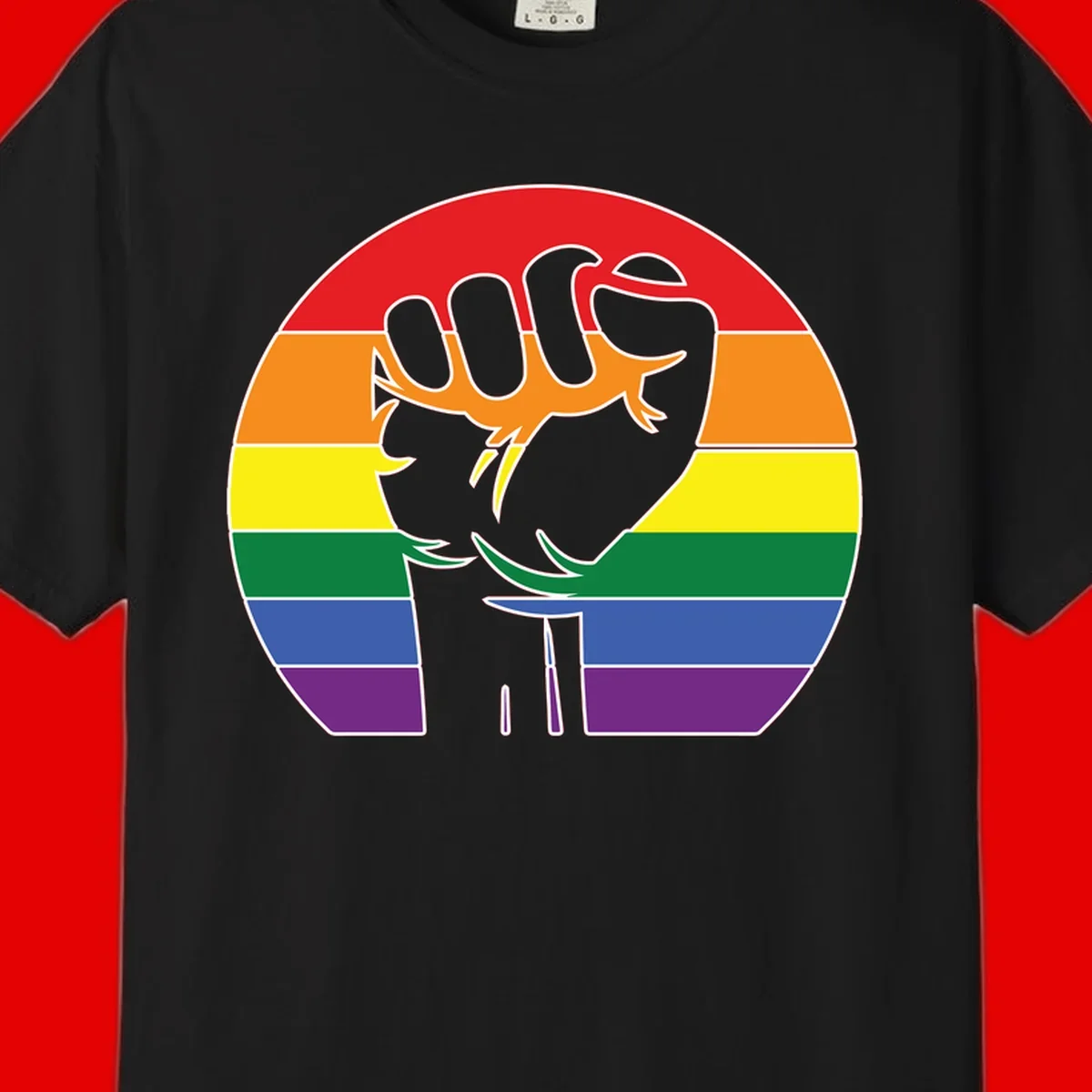 Gray dachshund with elongated body stretching across circular rainbow pride flag stripes in red, orange, yellow, green, blue, and purple