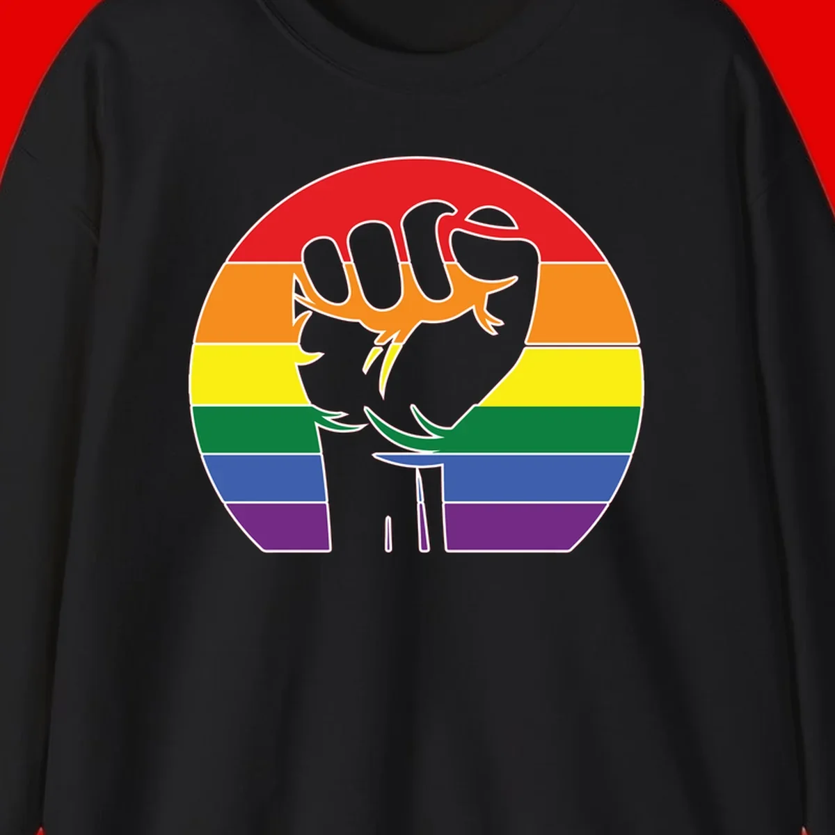 Gray dachshund with elongated body stretching across circular rainbow pride flag stripes in red, orange, yellow, green, blue, and purple