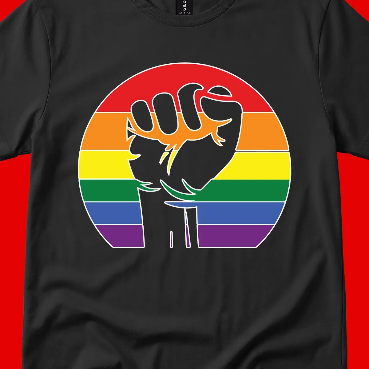 Gray dachshund with elongated body stretching across circular rainbow pride flag stripes in red, orange, yellow, green, blue, and purple