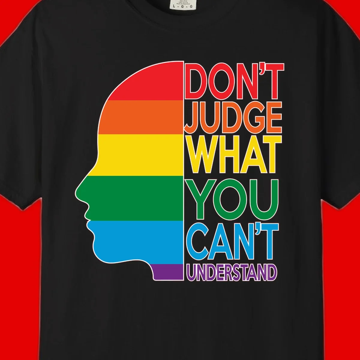 Rainbow-striped head silhouette with text 'Don't Judge What You Can't Understand' promoting LGBTQ acceptance and inclusion