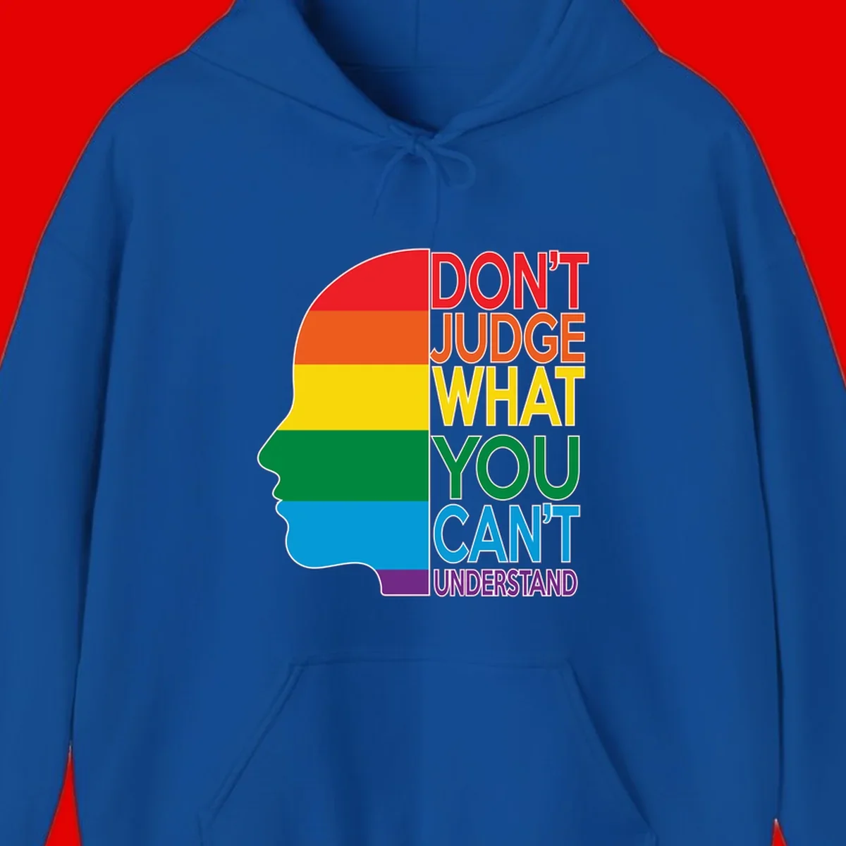 Rainbow-striped head silhouette with text 'Don't Judge What You Can't Understand' promoting LGBTQ acceptance and inclusion