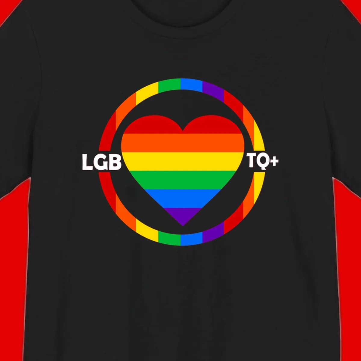 Rainbow heart with LGB TO+ text in concentric pride circles on gray background