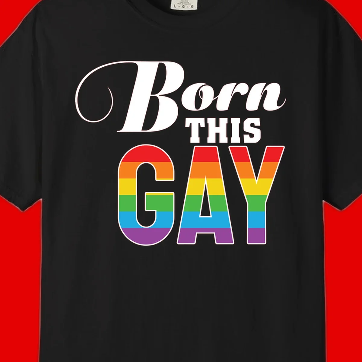 Born This Gay pride design with rainbow flag stripes filling large letters on gray background