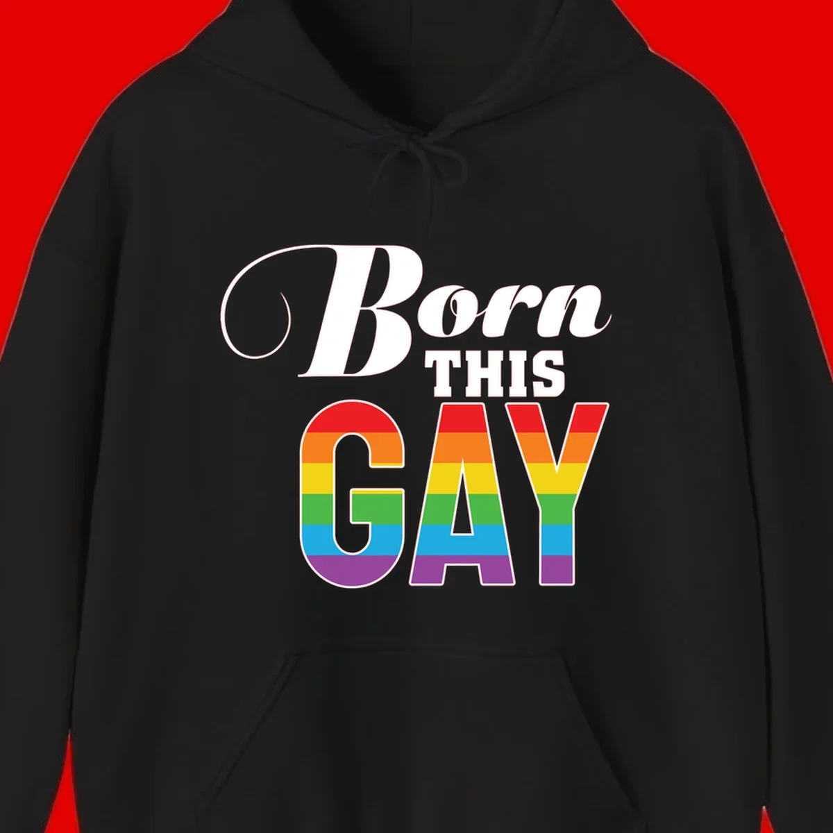Born This Gay pride design with rainbow flag stripes filling large letters on gray background
