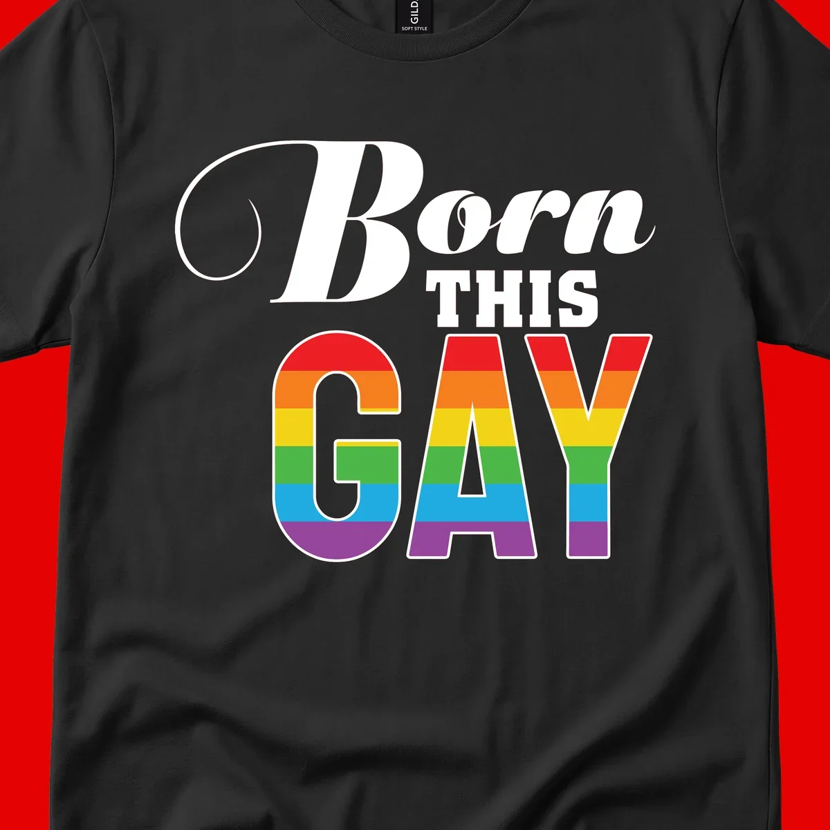 Born This Gay pride design with rainbow flag stripes filling large letters on gray background