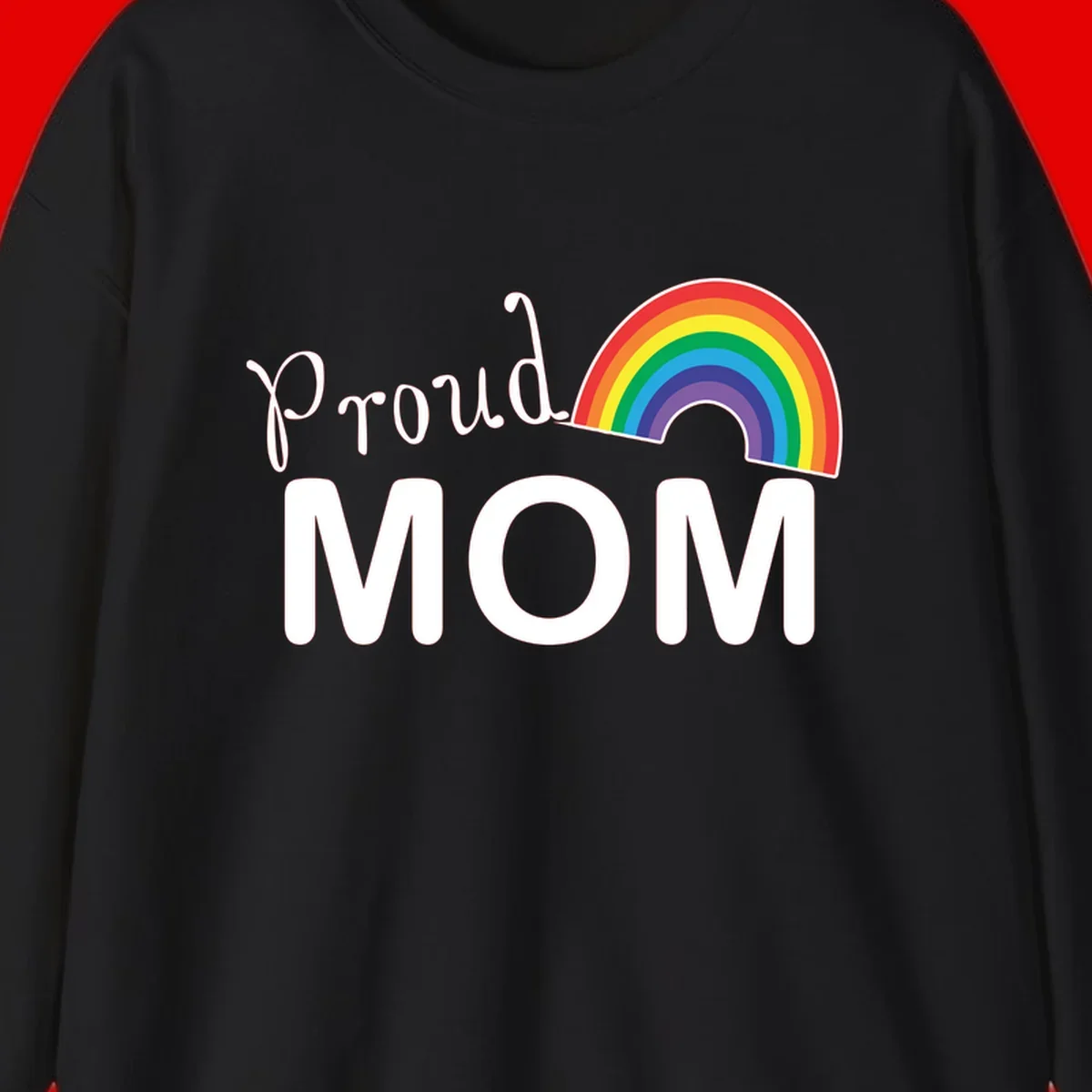 Proud Mom design with white text and vibrant rainbow arc on gray background