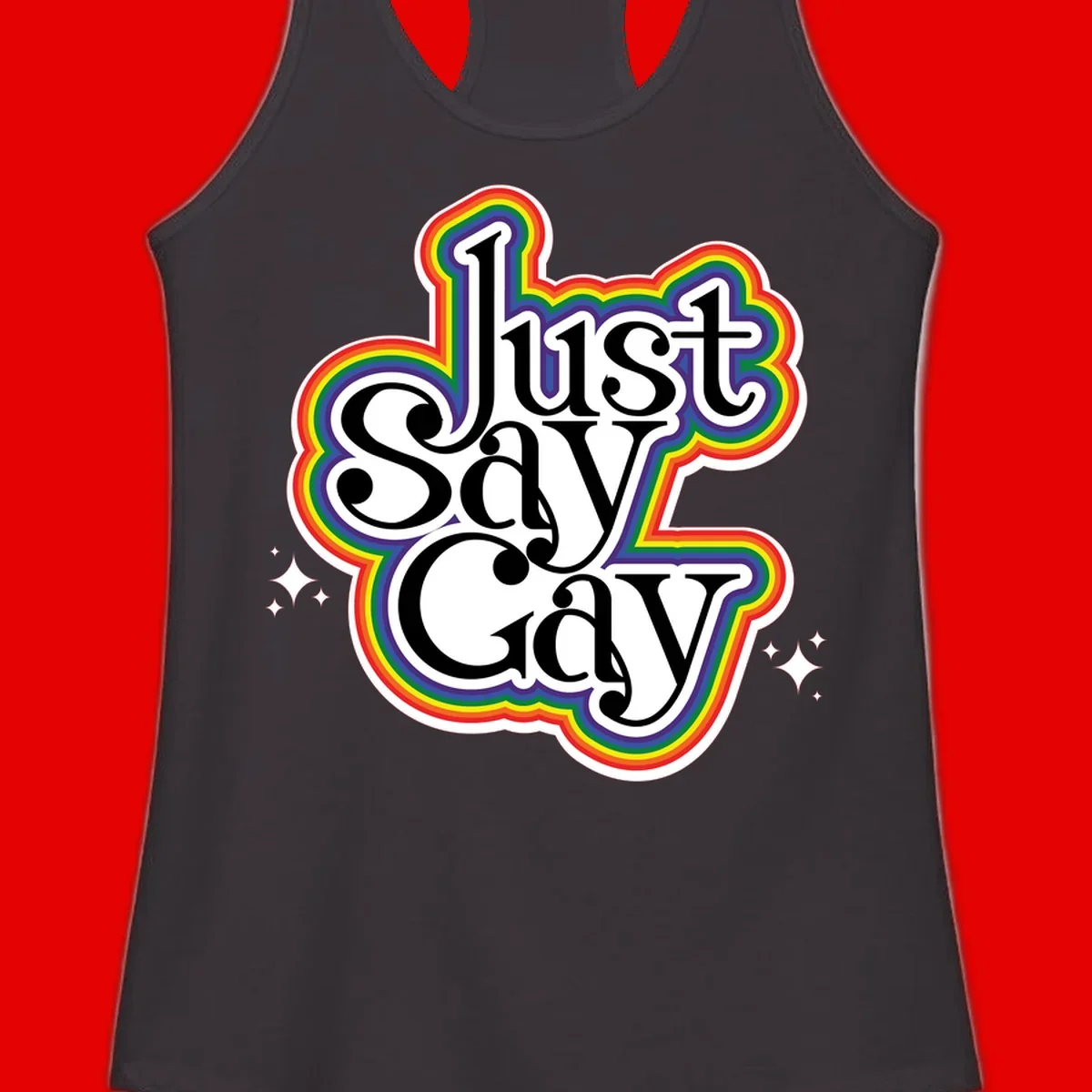 Just Say Gay Pride design with bold black text surrounded by vibrant rainbow border and sparkle accents on gray background
