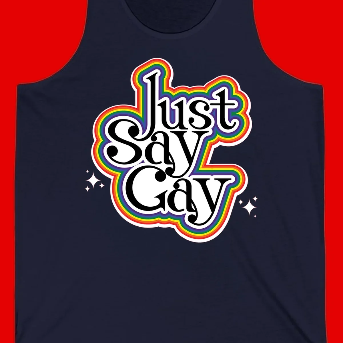 Just Say Gay Pride design with bold black text surrounded by vibrant rainbow border and sparkle accents on gray background