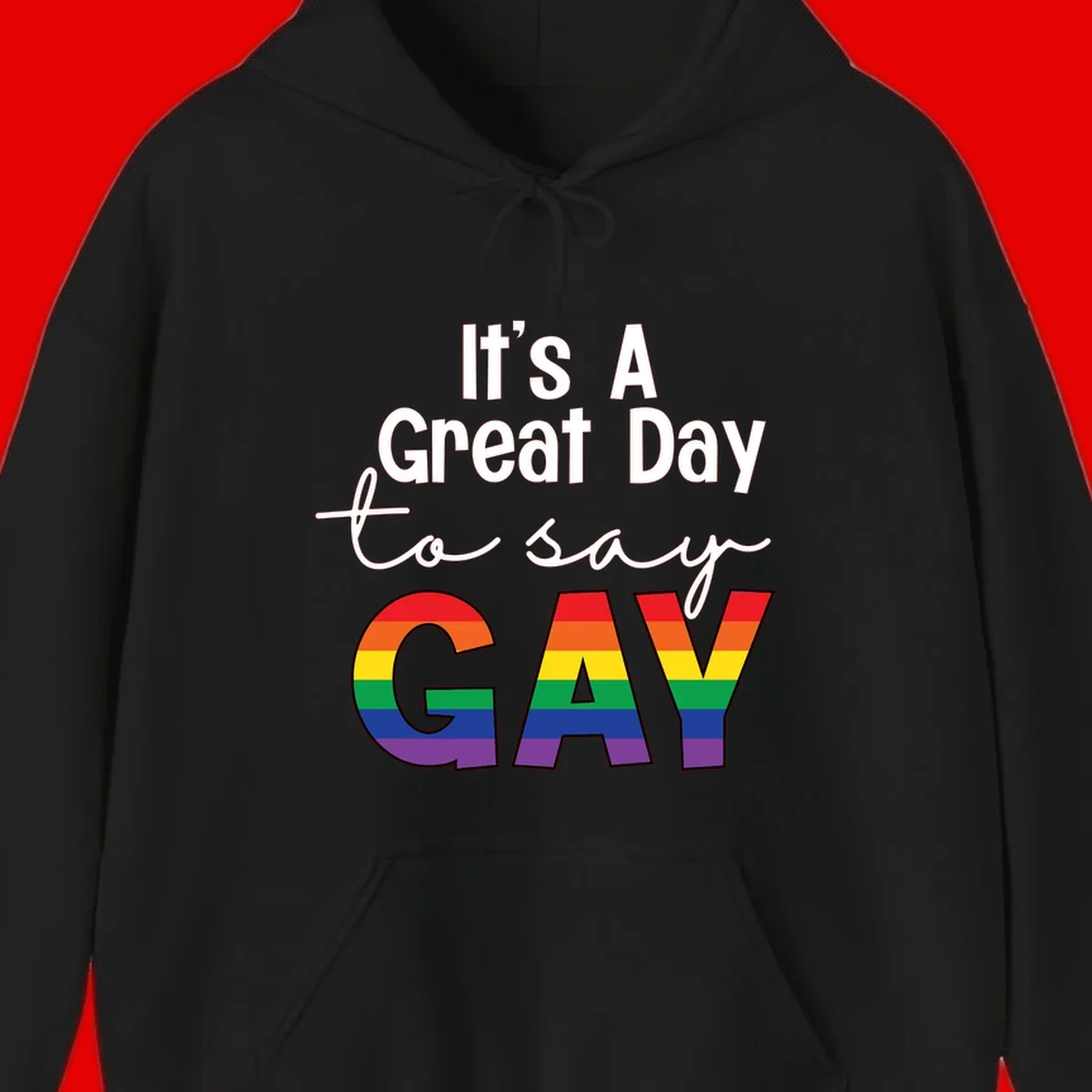 Gray background with white text reading 'It's A Great Day To Say' and the word 'GAY' in large letters filled with rainbow pride flag stripes