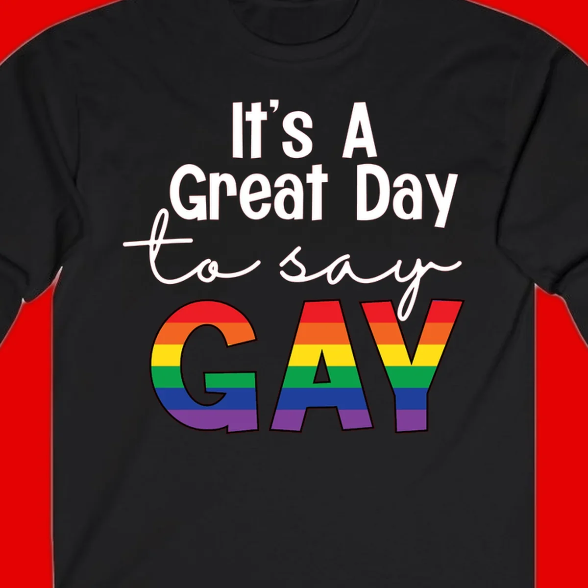 Gray background with white text reading 'It's A Great Day To Say' and the word 'GAY' in large letters filled with rainbow pride flag stripes