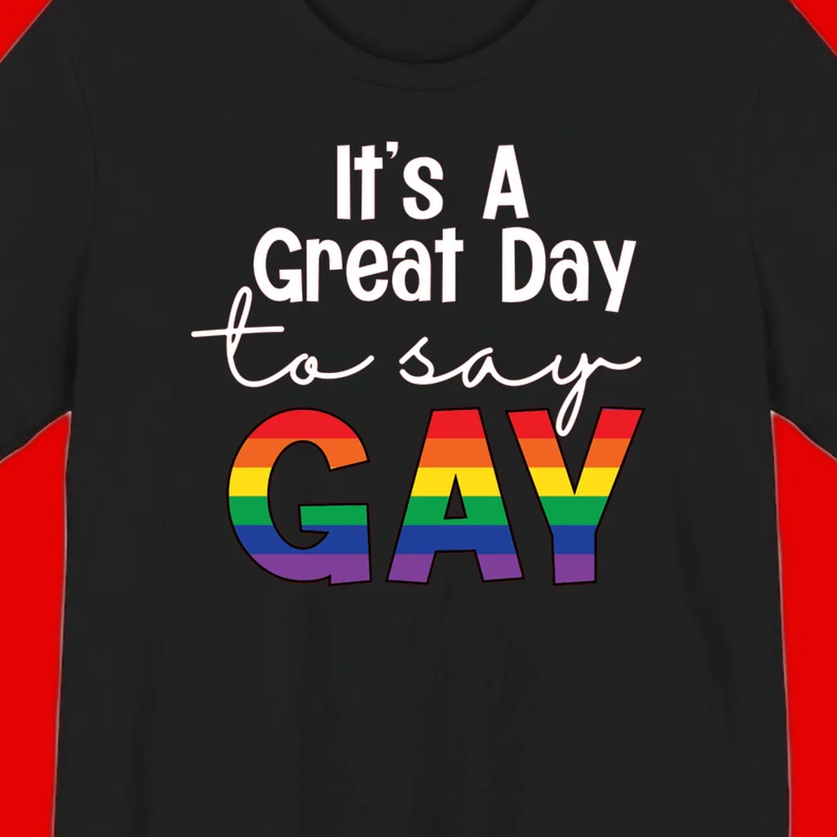 Gray background with white text reading 'It's A Great Day To Say' and the word 'GAY' in large letters filled with rainbow pride flag stripes