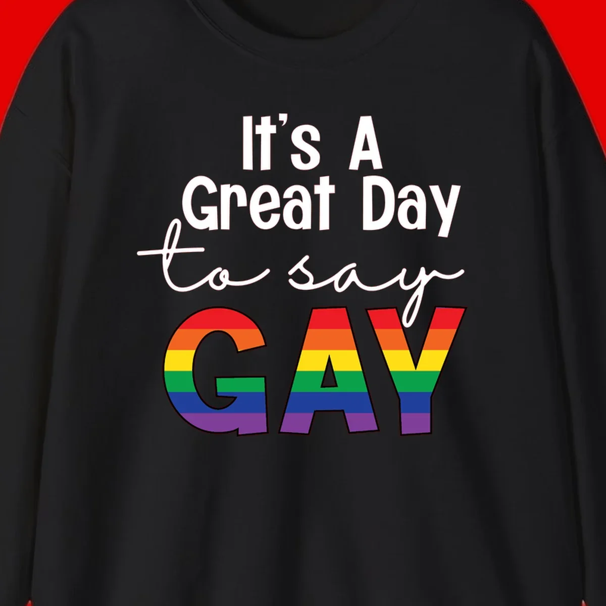 Gray background with white text reading 'It's A Great Day To Say' and the word 'GAY' in large letters filled with rainbow pride flag stripes