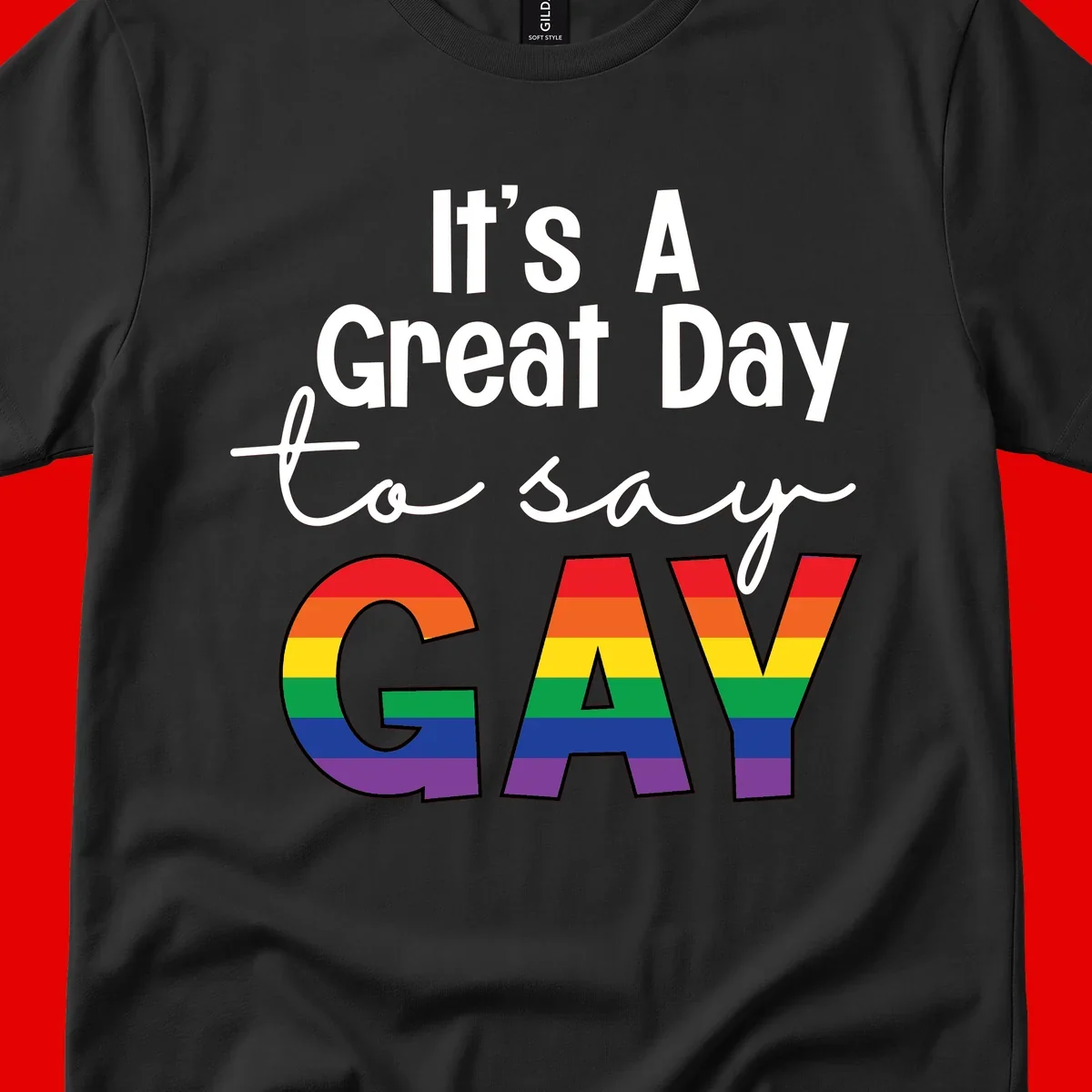 Gray background with white text reading 'It's A Great Day To Say' and the word 'GAY' in large letters filled with rainbow pride flag stripes