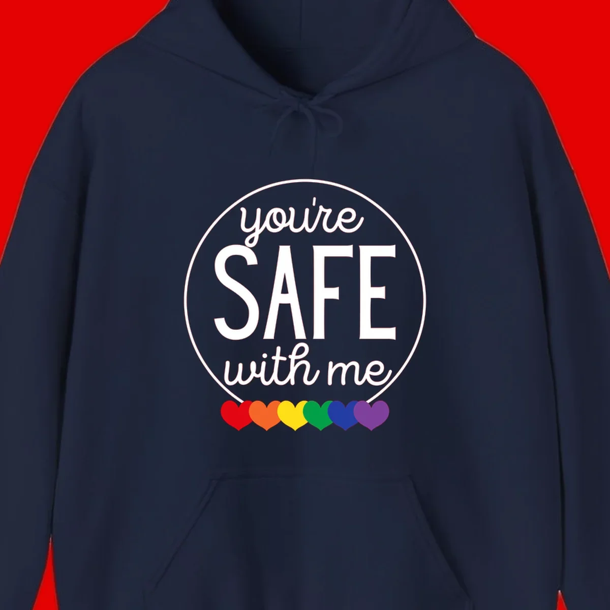 Circular badge with 'you're SAFE with me' text and rainbow pride hearts, promoting inclusive safe space message