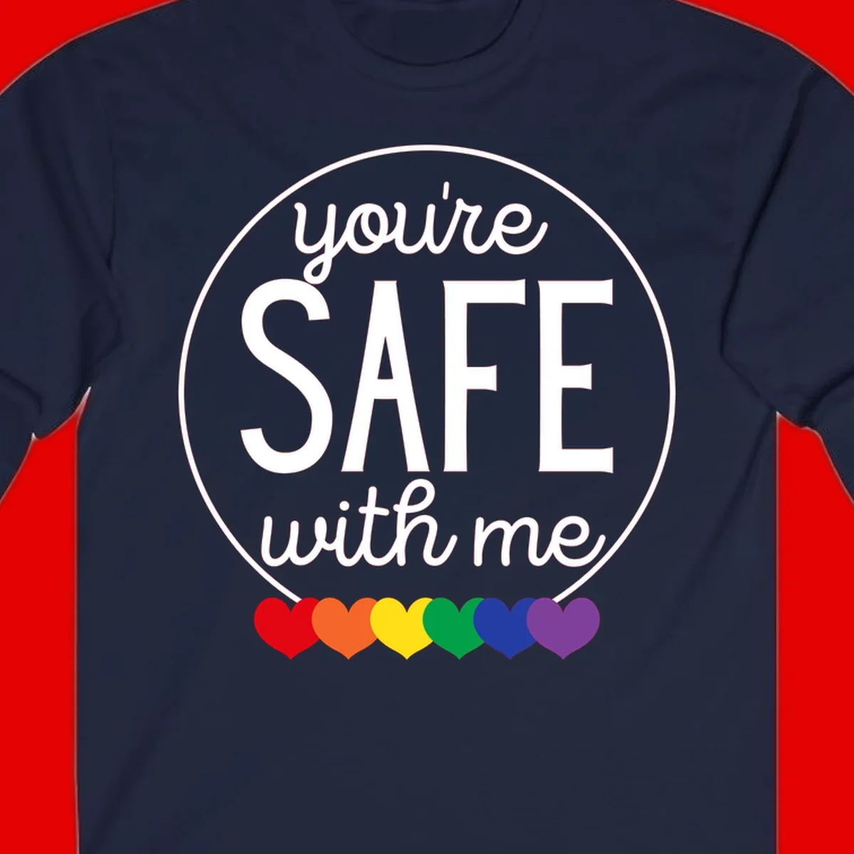 Circular badge with 'you're SAFE with me' text and rainbow pride hearts, promoting inclusive safe space message